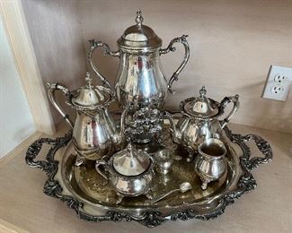 97 - $245 	Silver plated tea service with tray Poole pattern Bristol 8 pieces mono the Witchita Wives 		
