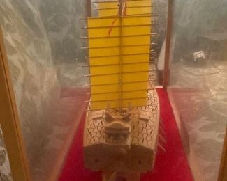 $180 wood carved ship in globe. 