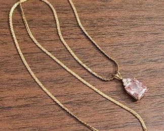 14k yellow gold chain and pendant with a pink CZ stone