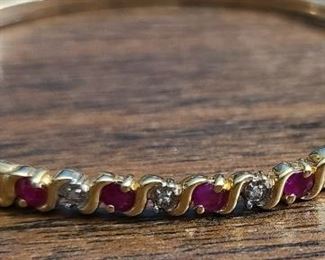 10k yellow gold bangle bracelet with tine Diamonds and Ruby gemstones