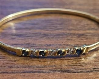 10k yellow gold bangle bracelet with tiny Diamonds and Sapphire gemstones