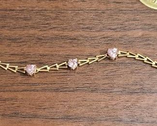 14k yellow gold bracelet with 3 heart shape pink CZ stones
