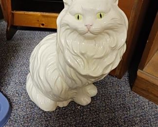 Ceramic cat with yellow eyes