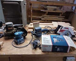 Assortment of corded power tools Sanders and saws