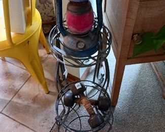 Antique red globe oil lamp and metal plant stand two tier