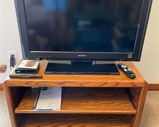 Oak TV Stand with shelves. Made in Mexico                                                              29.75"W 16.5"D 18.5"H                                                                               $35.00