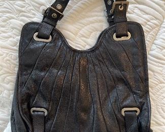 Women's black leather handbag by Stuart Weitzman