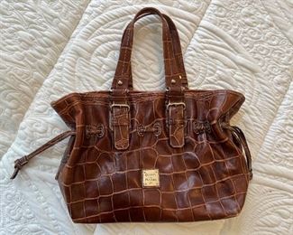 Women's brown leather handbag by Dooney & Bourke