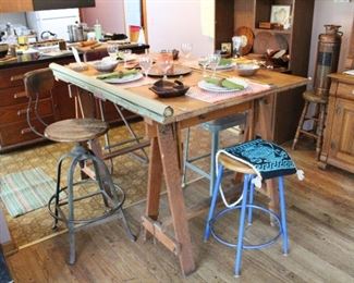 Antique drafting table makes an excellent hi-top dining table!  Perfect for your kitchen or bar!  Measures 60" long, 42" wide, and 38" tall at its lowest point.  Can be raised another 10".