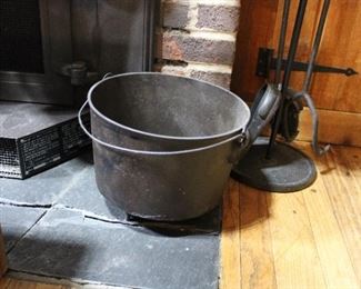 Antique cast iron kettle on feet with bail handle