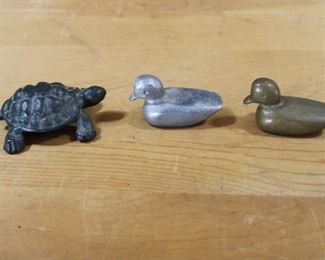 Cast iron turtle, cast aluminum duck, cast brass duck