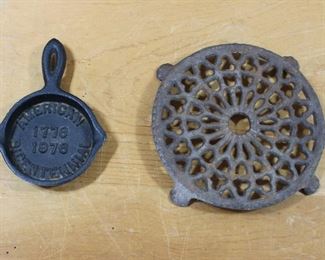 Bicentennial cast iron frying pan and antique cast iron trivet