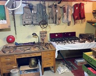 Antique lumbering tools, Ford wrenches, fishing vests, axes and hatchets, vintage auto body tools