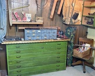 Great old storage cabinets, Browning compound bow in case, reloading equipment, antique oak desk chair
