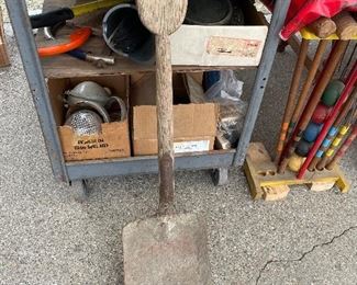 Old shovel with handle carved from one piece of wood.