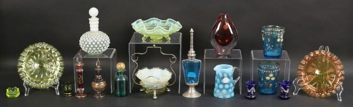 26	Lot of Glass Items Including Art Glass	Seventeen glass pieces including silverplate and  ruffled glass condiment dish, three ruffled dishes, Fenton style creamer, two painted tumblers, Orrefors signed art glass vase, four perfume bottles, hobnail milk glass bottle, three painted glasses, one salt, two painted Bohemian cabinet vases. Scratches and paint loss, crack in one tumbler. Hobnail bottle 6 1/4"H.
