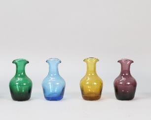 27	Pair of Art Glass Vases & 4 Bottles	Pair of art glass vases, unsigned, each 7 3/8"H; with 4 colored glass bottles, each 3 7/8"H.
