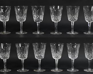 33	12 Waterford Lismore Crystal Water Goblets	12 Waterford Lismore Crystal Water Goblets 6 7/8" . Chip on base of 1 glass. 2 with paper labels.
