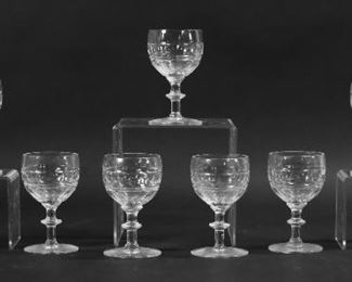 37	9 Webb Corbett Crystal Sherry Glasses	9 pieces Webb Corbett crystal stemware. Sherry glasses, each 3 7/8"H. Chips to base on one, base on one uneven.
