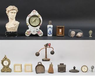 40	Grouping of Desktop Items	Bust on marble stand marked G. Carusi; metal bank; Delft perfume bottle; miniature framed cameo; wax seal; cast iron paperweight; miniature broom and dustpan; carved wooden balancing toy, 9" T; glass and silverplate hot air balloon; carved stone faces; loose clock face; two metal Looping alarm clocks, scratches and paint loss; metal miniature mantle clock, scratches;  porcelain miniature mantle clock marked Dresden, 5 1/2" T; working condition of clocks not known.
