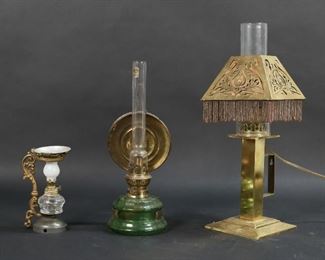 43	3 Kerosene Lamps	"3 kerosene lamps. Green glass with brass reflector and later chimney, 13""H with chimney; miniature kerosene vaporizer / medical lamp, 6 1/4""H; Bradley electrified brass kerosene lamp with beaded shade, 16""H with chimney.

Reflector detached from green glass lamp, paper lining on beaded shade tearing and some beads missing."
