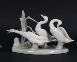 84	5 Lladro Porcelain Figurines Angels & Ducks	5 Lladro porcelain figurines. Angel Praying, bisque Angel Thinking, Geese Group, Preening Goose, Duck With Ducklings. Geese Group 9 3/4"L x 5 3/4"H. Repair to leaves on Geese Group.
