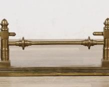 101	Art Nouveau Style Fire Fender	"Art Nouveau style brass fire fender. Early 20th century. Brass, foliate motifs. Wear and marks throughout fender. Bends to brass on corners of left and right back posts. 

10 1/2"" x 60"" L"
