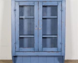 102	Rustic Painted Hanging Cabinet	"Rustic painted wall cabinet. 20th century. Glazed doors, two fixed shelves, lower shelf. Wear, scratches, scuffs, and losses to wood and paint throughout cabinet. Chips to wood on top edges and corners of cabinet. 

26 3/4"" W x 8 3/8"" D x 34 1/8"" H

"
