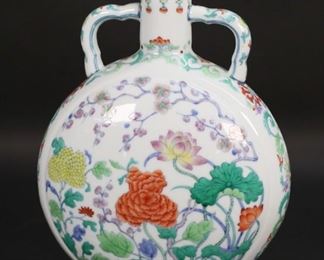 147	Chinese Porcelain Moon Flask Vase Yongzheng Mark	"Chinese porcelain moon flask vase. Floral decoration, blue Yongzheng mark to the underside. 10 1/8""H. Small firing crack to underside.
"
