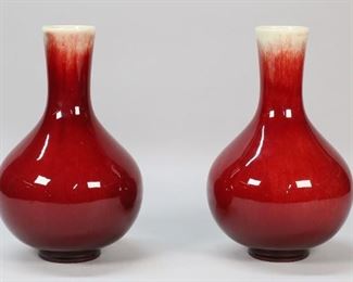146	Pair of Chinese Porcelain Flambe Vases	Pair of Chinese sang de boeuf glazed vases. Each 9 7/8"H. Lines to glaze on one.
