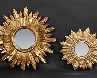 158	2 Mid-Century Giltwood Sunburst Mirrors	2 carved gilt wood sunburst form mirrors. Larger 21"-diameter.
