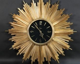 157	Mid Century Modern Syroco Sunburst Wall Clock	"Mid century modern Syroco sunburst starburst wall clock. ""Syroco Made in USA"" on face. Made by Syracuse Ornamental Company Inc. in Syracuse, New York, USA from ""Syroco Wood Line"" Battery operated. Working but accuracy is untested,
23.25"" diameter
"
