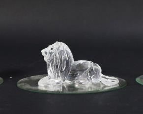 198	Swarovski Crystal 'Inspiration Africa' Figurines	Set of three Swarovski figurines titled 'Inspiration Africa'. Includes lion on mirrored plate, elephant on mirrored plate, and ibex on mirrored plate. All figures with a Swarovski Swan maker's mark. Elephant dimensions: 4 1/2" W x 3 1/2" D x 3 1/2" H.
