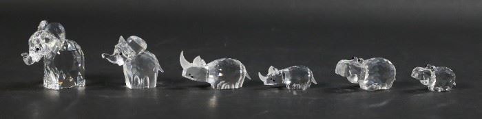 202	6 Swarovski Crystal Elephants, Hippos, Rhinos	6 Swarovski crystal animal figurines. 2 elephants, 2 rhinoceros, 2 hippopotamuses. All with Swarovski swan marks. All with original boxes. Larger elephant 2 3/8"H.
