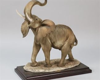 243	Giuseppe Armani Elephant Figure	Giuseppe Armani figure on wooden base. Includes 2 artist signatures. 10 1/2" W x 6 1/2" D x 11 5/8" H (figure and base).
