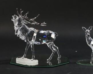 257	3 Swarovski Crystal Figurines Deer	3 Swarovski crystal deer figurines. Fawn, doe and stag. All with Swarovski swan marks. All with original boxes. Stag 5 1/2"L x 5 1/2"H.
