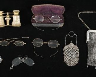 262	Mesh Bags, Opera Glasses, Vintage Eyeglasses	Mesh bag with HHCCO German silver frame, mesh bag with turquoise stones and sterling frame, pair of Iris French mother-of-pearl opera glasses, 6 pairs of vintage eyeglasses including Windsor. Larger mesh bag 7"W. Wear to mother-of-pearl on opera glasses, lens cracked on one pair of glasses.
