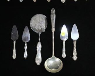 270	21 Sterling Handled Serving Pieces	Lot of 21 pieces of mixed sterling silver handled flatware serving pieces including ladle, cheese servers, shears, Raimond tomato server, serrated knife, pie and cake servers. Serrated knife 12 1/2"L.
