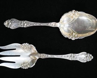 272	2 Piece Whiting Solid Sterling Salad Set	Two piece Whiting sterling silver salad set in the pattern 'Lily-Floral'. Includes serving spoon and fork. Spoon measures 9" in length. Total weight is 220 grams.
