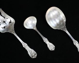 274	Reed & Barton Sterling Salad Set and Ladle	Three pieces of Reed & Barton sterling silver flatware in the 'Francis I' pattern. Includes a matching solid salad set and a small ladle. Spoon belonging to salad set measures 9 1/2" in length. Total weight 376 grams.
