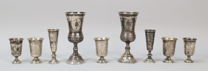 281	Lot of Sterling & 84 Silver Kiddush Cups	9 silver Kiddush cups. 2 sterling, 156 grams; 7 hallmarked Russian 84 (.875) silver, 180 grams. Largest 5 1/4"H. Bases dented on all, rims dented on 2 sterling cups.
