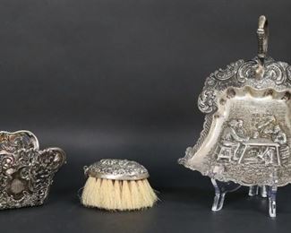 280	Dutch & French Silver Lot	3 piece silver lot. Hallmarked Dutch 833 silver brush and crumb tray with tavern scenes, tray 248 grams, brush 84 grams; hallmarked French 950 silver asparagus server, 134 grams. Crumb tray 5 7/8"W.
