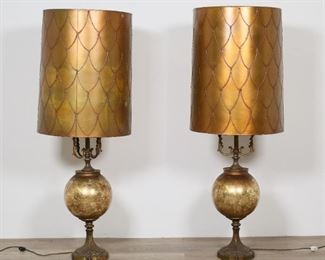 342	Pair Mid-Century Brass & Glass Lamps	Pair of mid-century brass lamps with crackle glass orbs. 37 1/2"H including finials, shades 15"-diameter. One lamp missing two arms, some oxidation and discoloration to orbs under glass, tears to one shade, paint drips and some discoloration to both shades, finials mismatched.
