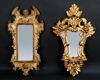 369	2 Carved Giltwood Mirrors	2 carved gilt wood mirrors, grape and leaf, and figural with woman's and lion's heads. Grape and leaf mirror with Made in Spain label. Figural mirror 24 3/4" x 12 1/2". Split to wood on upper left side of figural mirror.
