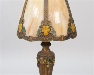 412	B&H Style Slag Glass Lamp	B&H style slag glass lamp. Patinated metal base with floral decoration, caramel slag glass shade with patinated metal overlays with floral decoration. Unsigned. 17 1/4"H including finial.
