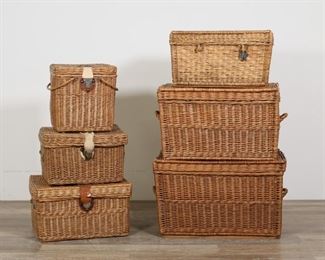 419	Grouping of Six Wicker Trunks and Basket	"Grouping of six wicker baskets and trunks. 20th century. 5 trunks, one basket with handles. 3 with leather and metal straps for locking. All as is, with wear, separations and losses to wicker, and tears to leather straps of all pieces. 

Largest trunk: 28 1/2"" W x 17 1/2"" D x 17"" H. Smallest basket: 13 3/4"" W x 10"" D x 13 1/2"" H (not including handles)."
