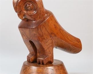 421	Signed M. Pereira Carved Wood Folk Art Owl	"Carved wood folk art owl sculpture. 20th century. Carved hardwood owl on base. Initialed with asterisk and ""MP"" on back of sculpture behind talon. Signed and dated ""M. PEREIRA 77"" on base. Small nicks to wood of base. Splits, cracks, and wear to sculpture and base. 

11 1/2"" W x 14 1/2"" D x 19 1/8"" H"
