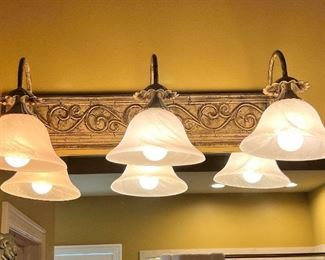 #129) - $125 -Wilson Lighting  Set of 2 Vanity Light Fixtures	24 inches each. Purchaser is responsible to deinstall from the home prior to March 31.