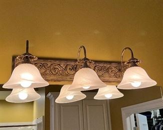#129) - $125 -Wilson Lighting  Set of 2 Vanity Light Fixtures	24 inches each. Purchaser is responsible to deinstall from the home prior to March 31.