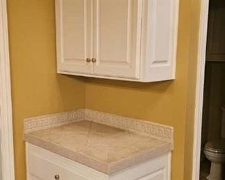 #H $300) White Bathroom 3-Drawer section, Countertop and Double Upper Cabinets. Includes Hardware and countertop.   Lower Section. 33 5/8 Tall and 35 1/2 wide.   Upper Section 42 1/2 Tall and 36" Wide with cap. Purchaser must remove on their own or with their own contractor help prior to March 31. 